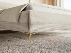 Łóżko tapicerowane 180x200 cm Roule Cord z pojemnikiem stelaż metalowy jasnobeżowe sztruks nóżki złote