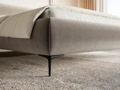 Łóżko tapicerowane 140x200 cm Roule z pojemnikiem stelaż metalowy szarobeżowe welur hydrofobowy nóżki czarne