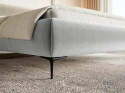 Łóżko tapicerowane 140x200 cm Roule z pojemnikiem stelaż metalowy jasnoszare welur hydrofobowy nóżki czarne