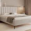 Łóżko tapicerowane 180x200 cm Veloro z pojemnikiem beżowe welur stelaż metalowy na wysokich nóżkach